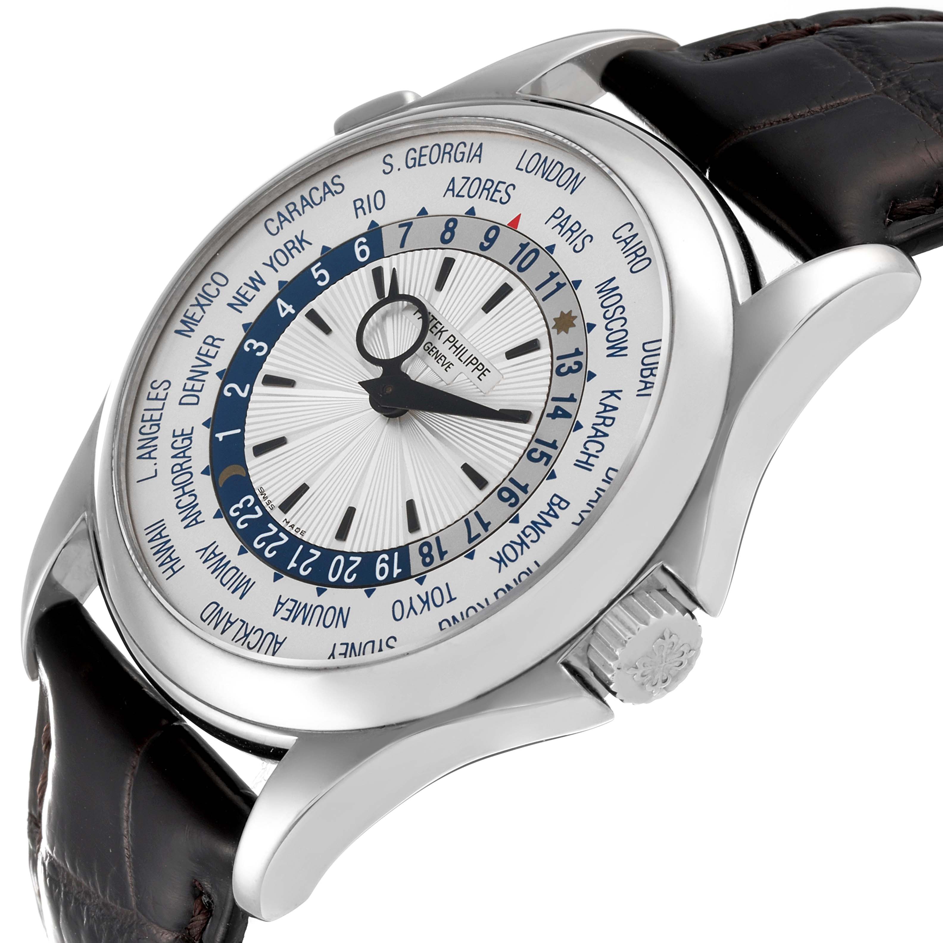 The image shows a side and partial front view of the Patek Philippe Complications 5130G Men's White Gold Silver Dial 5130G Men's White Gold Silver Dial watch, highlighting the dial, crown, and leather strap.