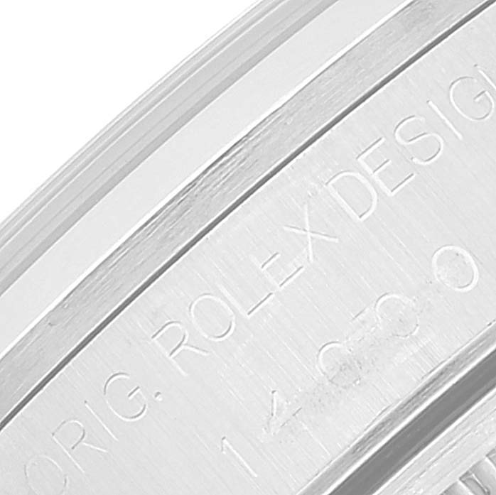 This close-up image shows a segment of the bezel or casing of the Rolex Air-King 14000 Men's Stainless Steel Blue Dial 14000 Men's Stainless Steel Blue Dial watch with engraved text.