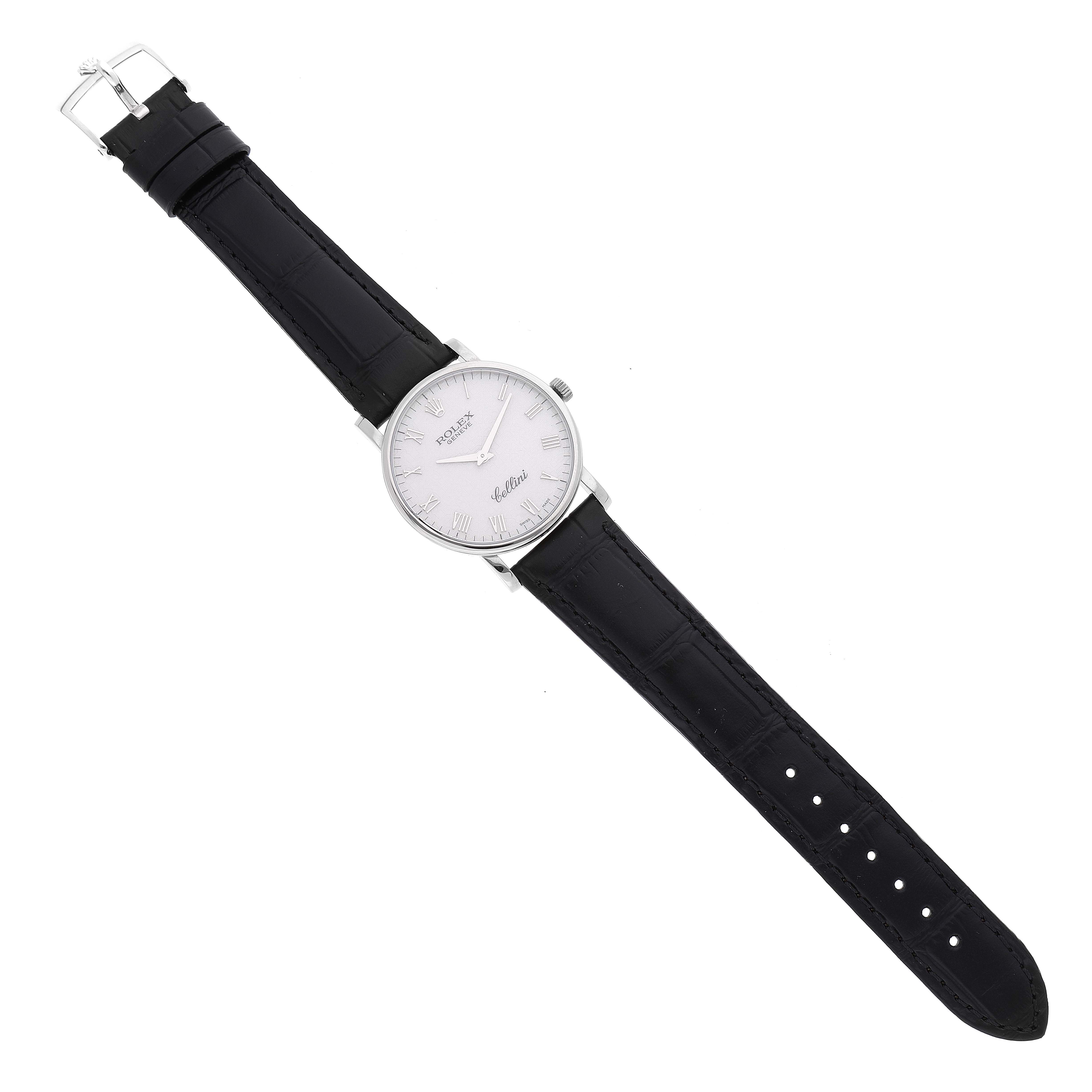 The image shows a Rolex Cellini 5115/9 Men
s White Gold Beige Dial 5115/9 Men
s White Gold Beige Dial watch laid flat with a black leather strap and a white dial.