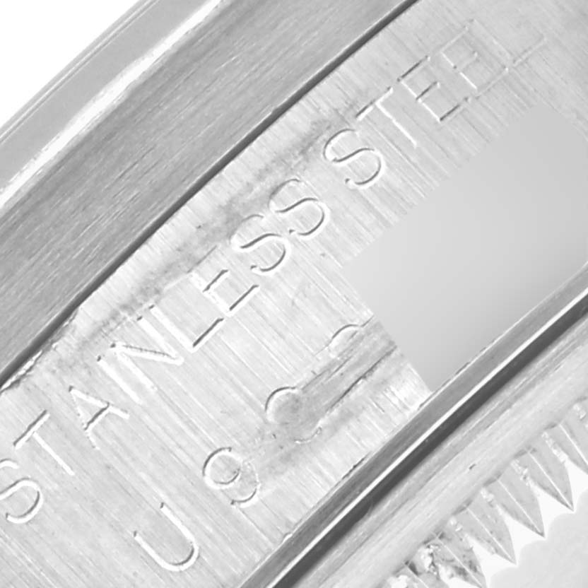 The image shows a close-up of the inner watch case of a Rolex Date 15210 Men
s Stainless Steel Black Dial 15210 Men
s Stainless Steel Black Dial model, highlighting engraving details.