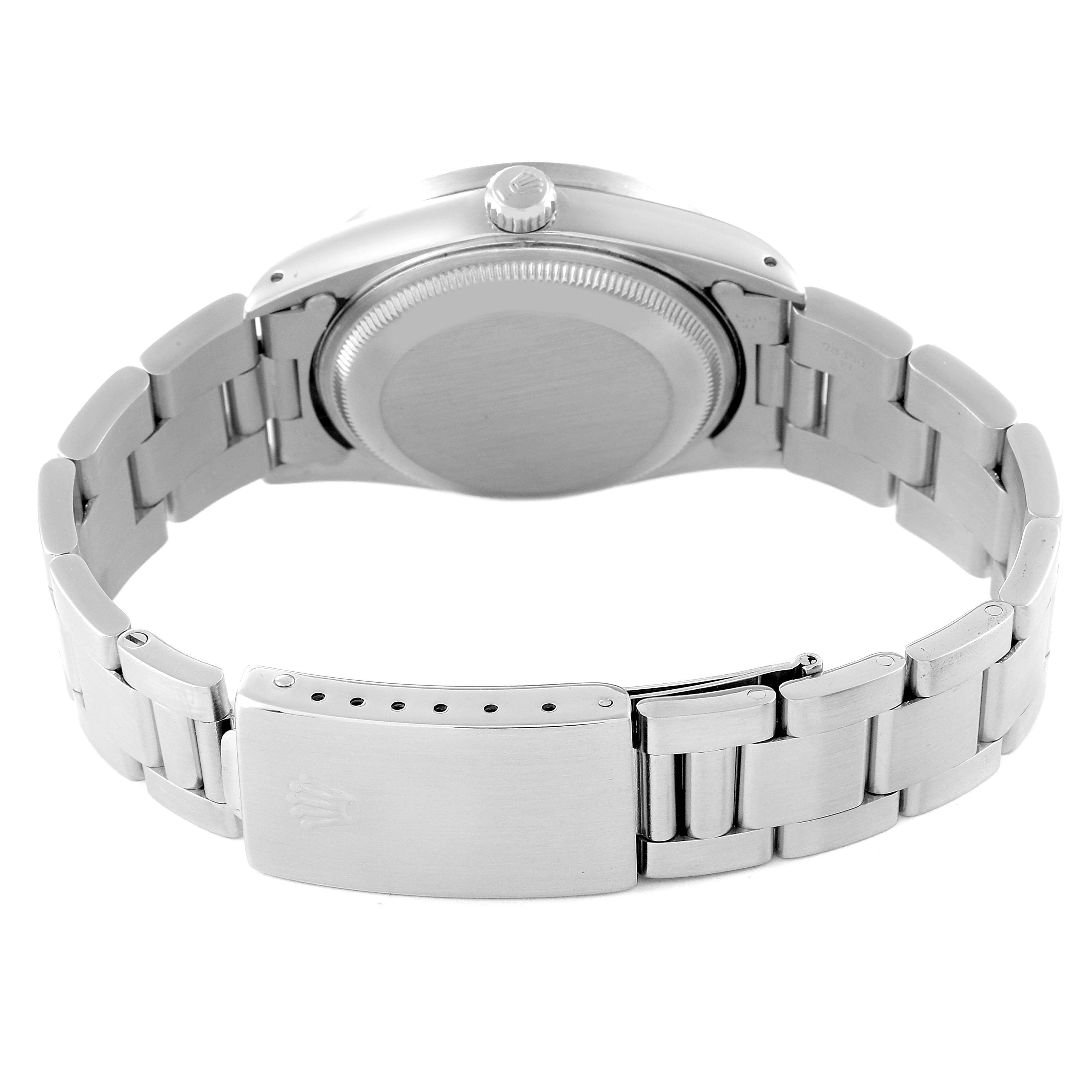 This image shows the back of the Rolex Date 15210 Men
s Stainless Steel Silver Dial 15210 Men
s Stainless Steel Silver Dial model, highlighting its clasp, bracelet, and case back.