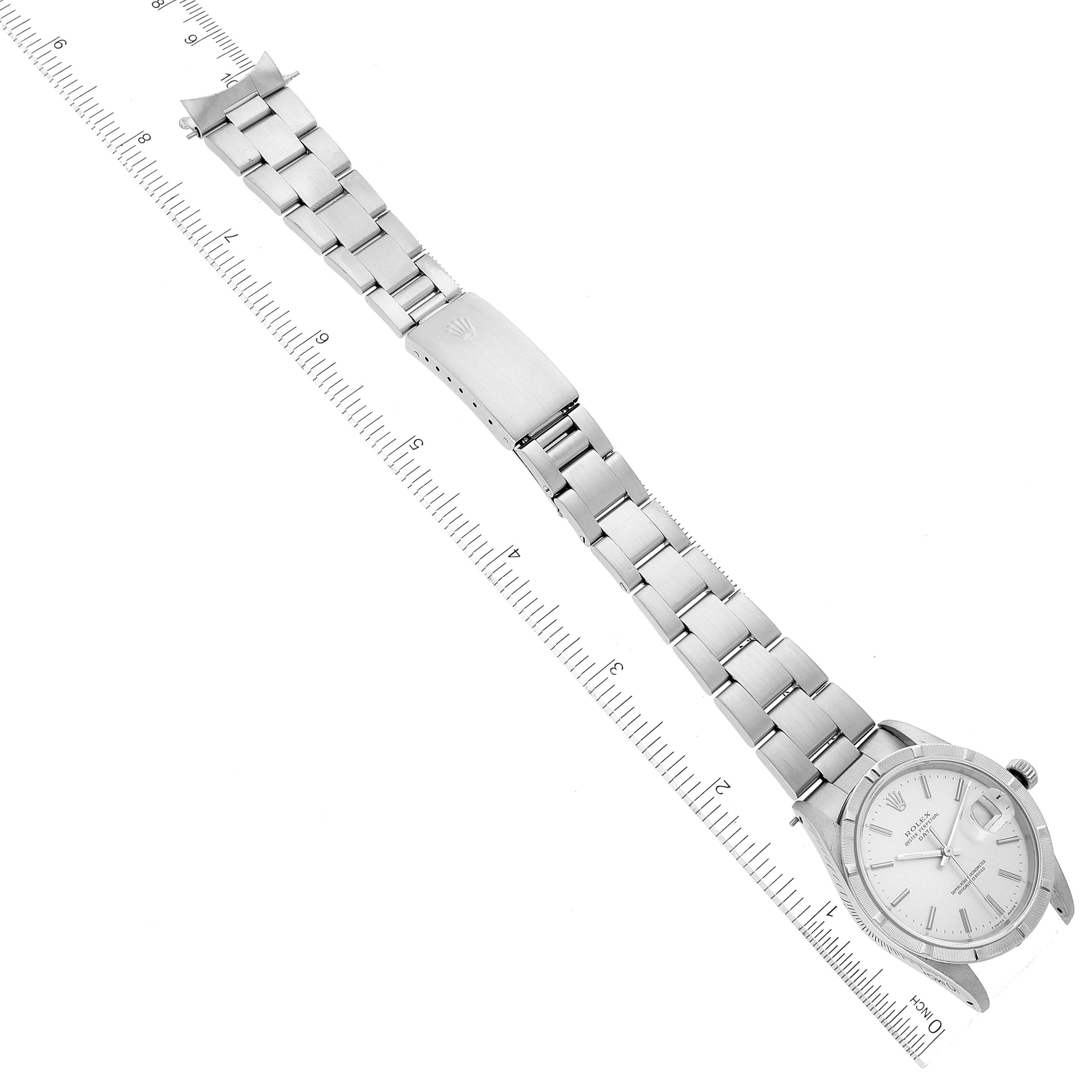 The image shows a top-down view of a Rolex Date 15210 Men
s Stainless Steel Silver Dial 15210 Men
s Stainless Steel Silver Dial model watch, displaying the full bracelet and part of the dial.