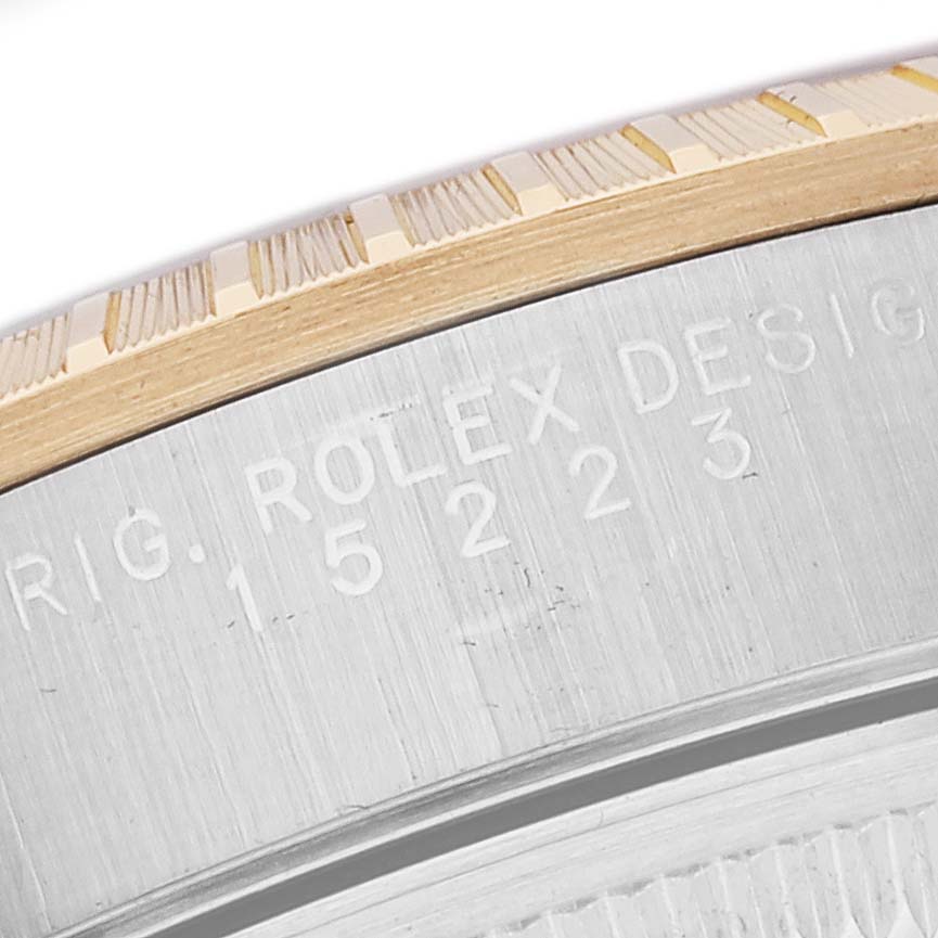 This close-up image shows the case and bezel engraving of a Rolex Date 15223 Men
s Steel and Gold (two tone) White Dial 15223 Men
s Steel and Gold (two tone) White Dial model watch.