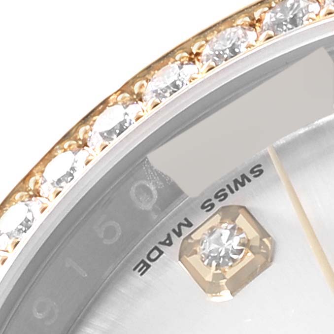A close-up view of the bezel with diamonds, dial, and part of the markers of a Rolex Datejust 116243 Men's Steel and Gold (two tone) Silver Dial 116243 Men's Steel and Gold (two tone) Silver Dial watch.
