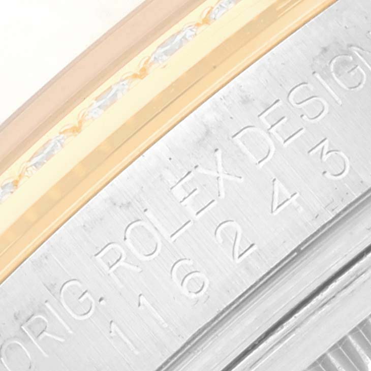 The image shows a close-up of the bezel and case edge of a Rolex Datejust 116243 Men's Steel and Gold (two tone) Silver Dial 116243 Men's Steel and Gold (two tone) Silver Dial watch, highlighting the engraved Rolex design and model number.