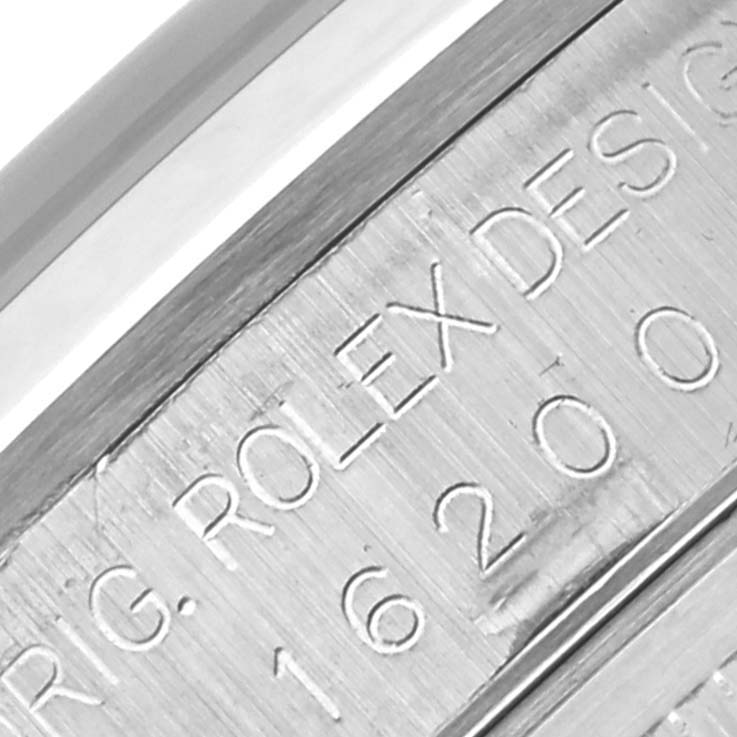 The image shows a close-up of the engraved side of the Rolex Datejust 16200 Men's Stainless Steel Black Dial 16200 Men's Stainless Steel Black Dial watch case.