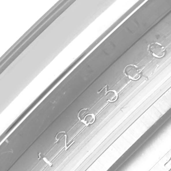 The image shows a close-up of the serial number engraved on the bezel of a Rolex Datejust 41 126300 Men
s Stainless Steel Blue Dial 126300 Men
s Stainless Steel Blue Dial watch.