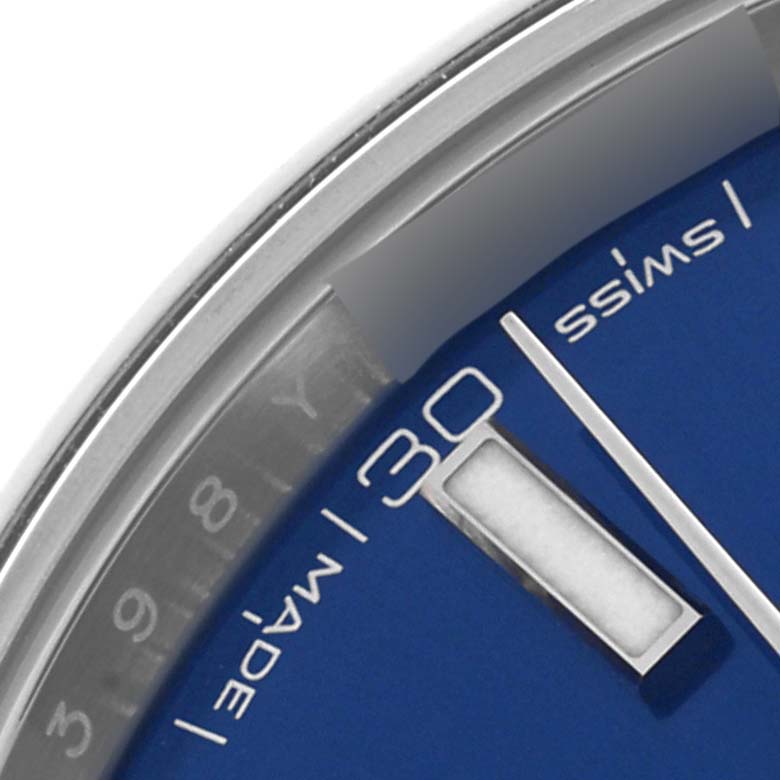 The image shows a close-up of the dial of a Rolex Datejust 41 126300 Men
s Stainless Steel Blue Dial 126300 Men
s Stainless Steel Blue Dial, focusing on the indices, minute markers, and “Swiss Made” text.