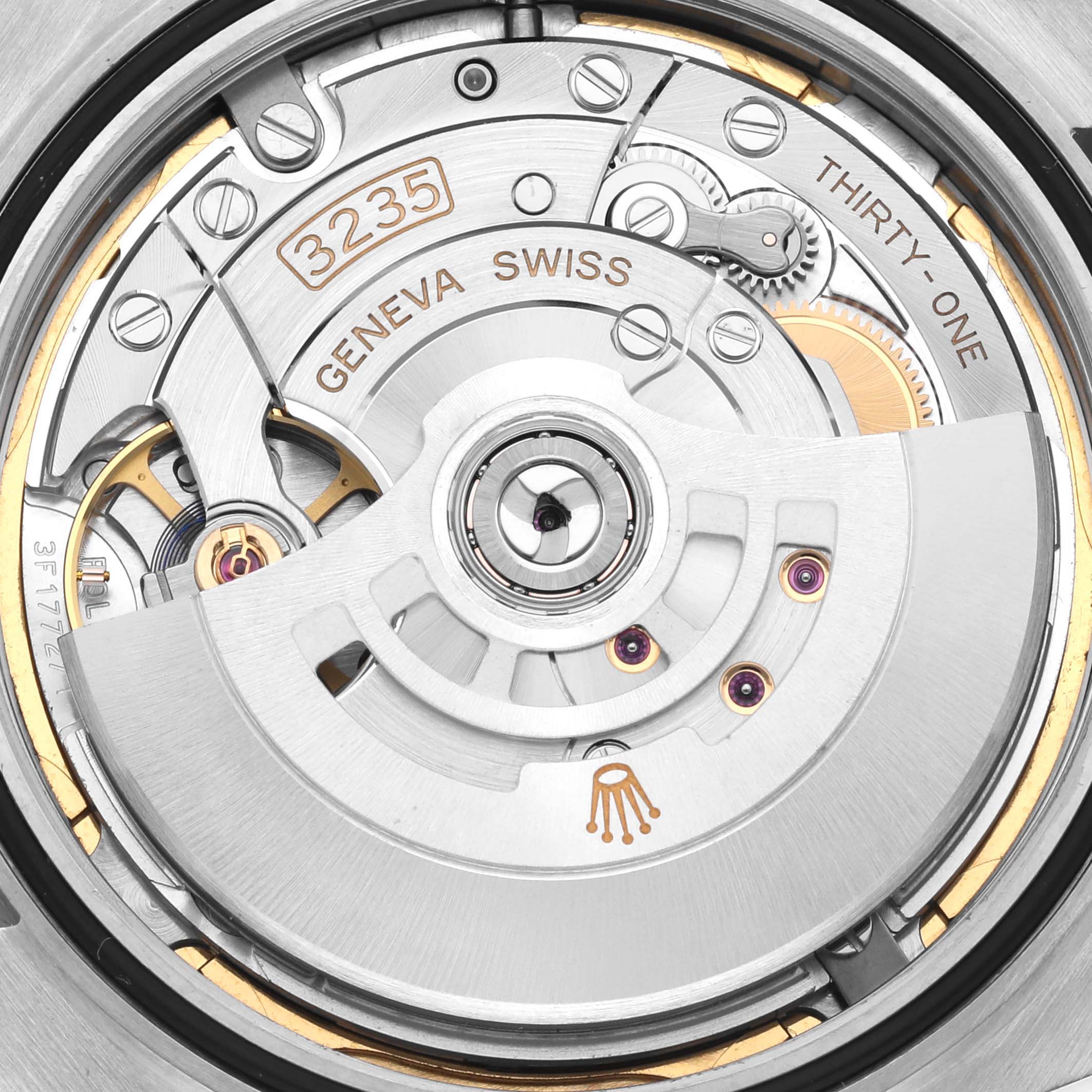 The image shows the movement of a Rolex Datejust 41 126300 Men
s Stainless Steel Blue Dial 126300 Men
s Stainless Steel Blue Dial, highlighting its intricate mechanical components from a top-down angle.