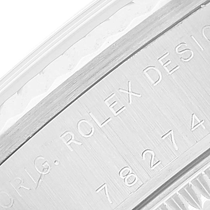 The image shows a close-up of the case number and "Rolex Design" engraving on the bezel of the Rolex Mid-Size 78274 Women's Stainless Steel Silver Dial 78274 Women's Stainless Steel Silver Dial model watch.