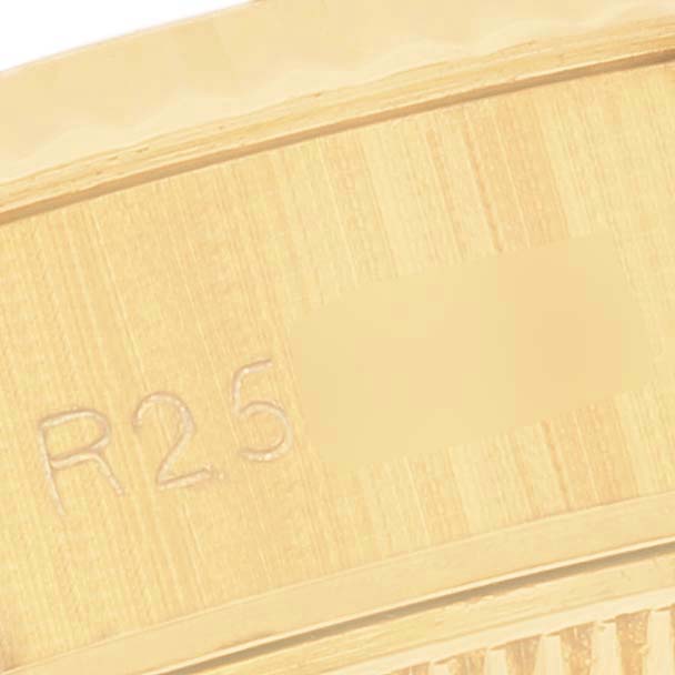 The image shows a close-up of the inner side of the bezel of a Rolex President 69178 Women's Yellow Gold Champagne Dial 69178 Women's Yellow Gold Champagne Dial model watch.