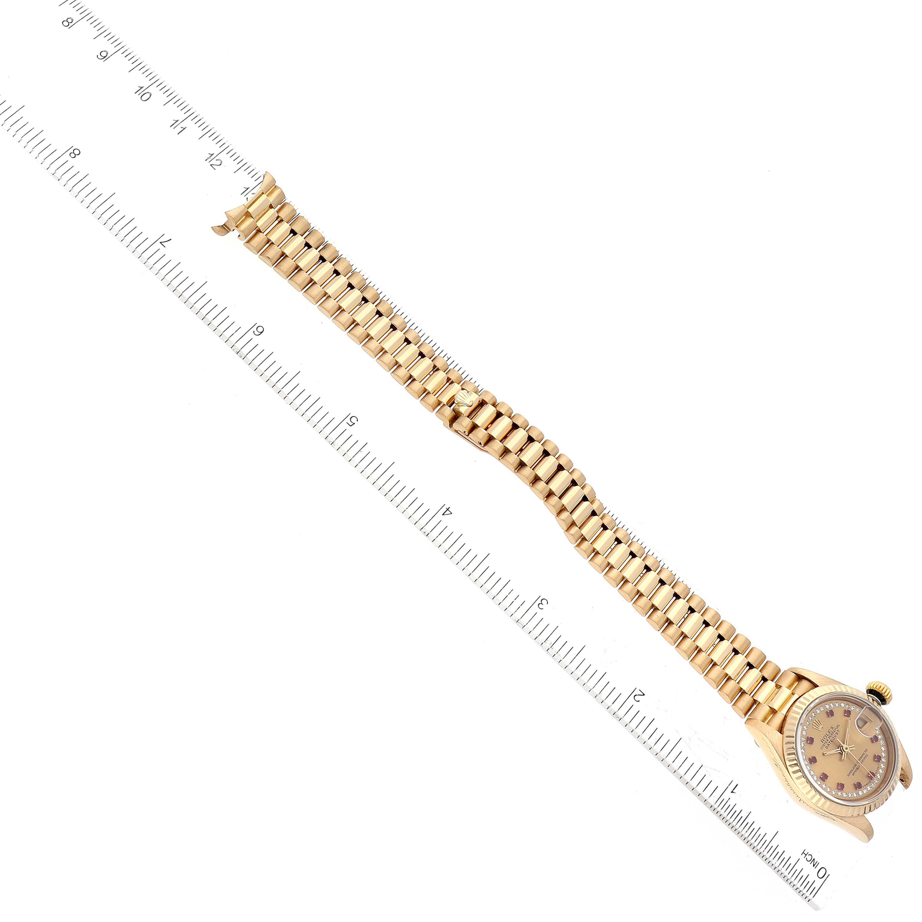 The image shows a Rolex President 69178 Women's Yellow Gold Champagne Dial 69178 Women's Yellow Gold Champagne Dial model watch laid flat with a ruler for scale.