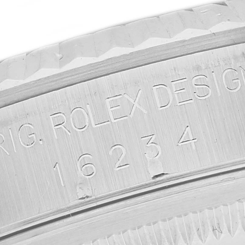 This is a close-up angle showing the serial number engraving on a Rolex Datejust 16234 Men's Stainless Steel Black Dial 16234 Men's Stainless Steel Black Dial model.