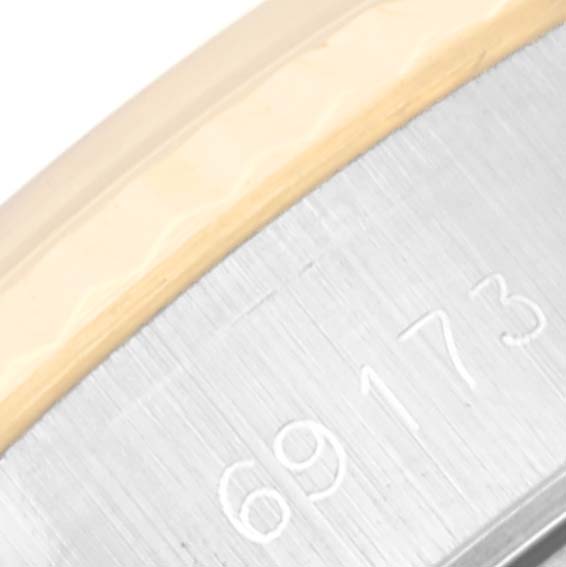 This close-up image shows the model number "69173" engraved on a part of the Rolex Datejust 69173 Women's Steel and Gold (two tone) Champagne Dial 69173 Women's Steel and Gold (two tone) Champagne Dial watch case.