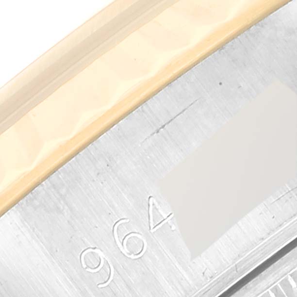 This image shows a close-up of the serial number engraving on a Rolex Datejust 69173 Women's Steel and Gold (two tone) Champagne Dial 69173 Women's Steel and Gold (two tone) Champagne Dial watch.