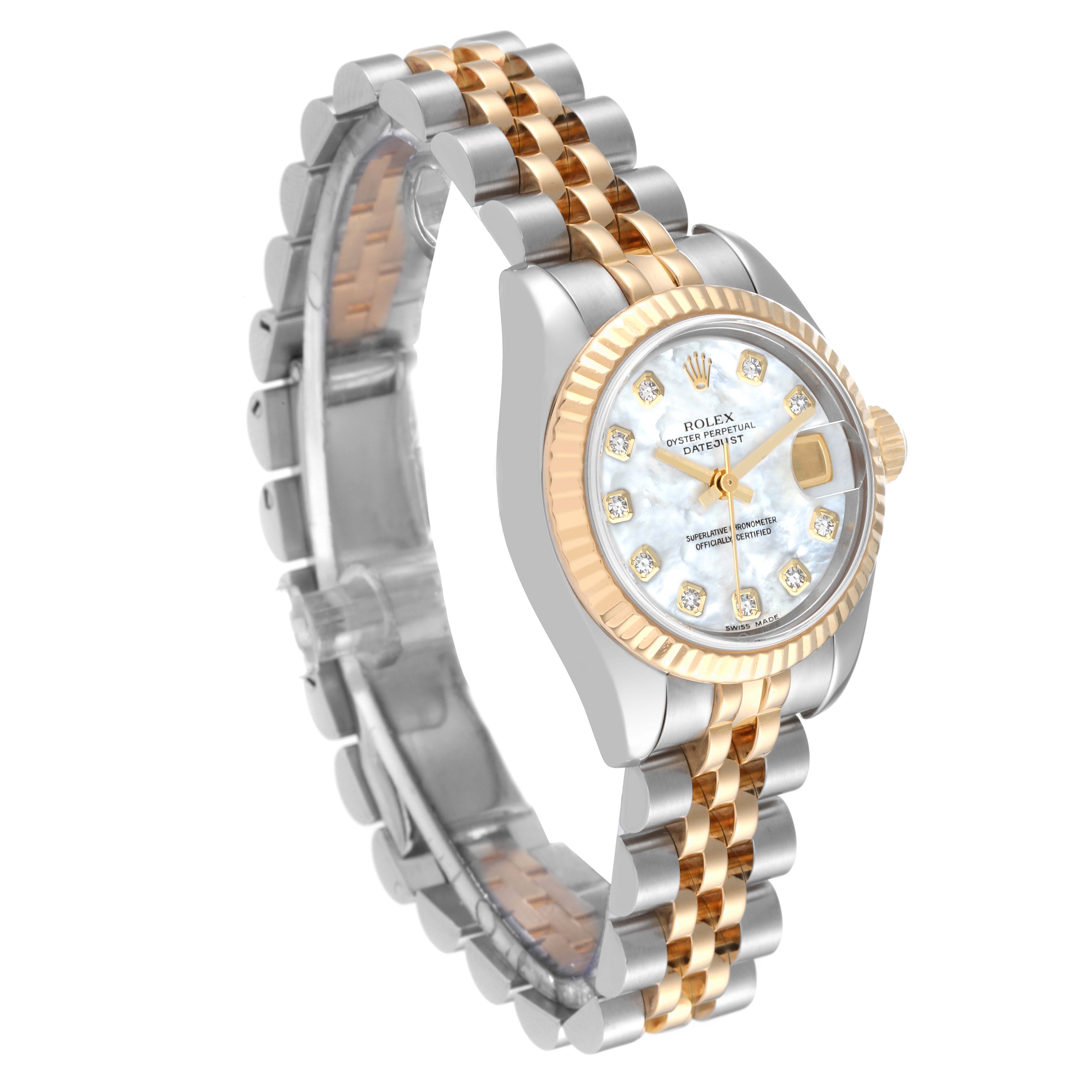 The image shows a Rolex Datejust 179173 Women's Steel and Gold (two tone) Mother of Pearl Dial 179173 Women's Steel and Gold (two tone) Mother of Pearl Dial watch at a three-quarter angle, featuring its dial, bezel, crown, and two-tone bracelet.