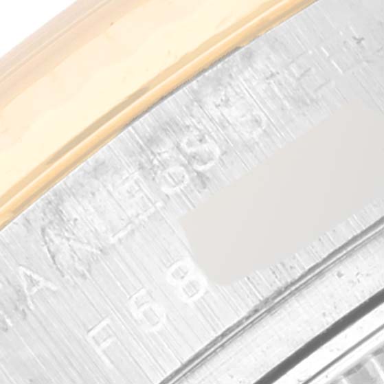 The image shows a close-up of the stainless steel case and fluted bezel of a Rolex Datejust 179173 Women's Steel and Gold (two tone) Mother of Pearl Dial 179173 Women's Steel and Gold (two tone) Mother of Pearl Dial watch.