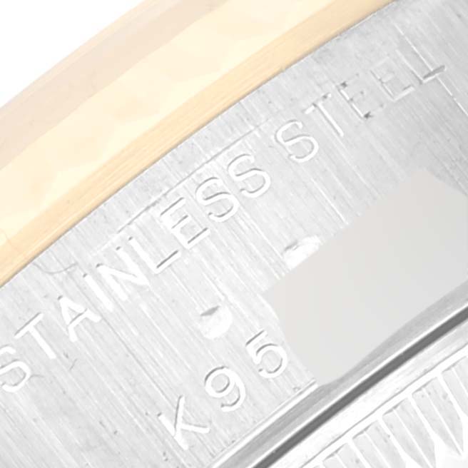 This close-up image of a Rolex Datejust 79173 Women's Steel and Gold (two tone) White Dial 79173 Women's Steel and Gold (two tone) White Dial watch shows part of the case back with the "STAINLESS STEEL" engraving visible.
