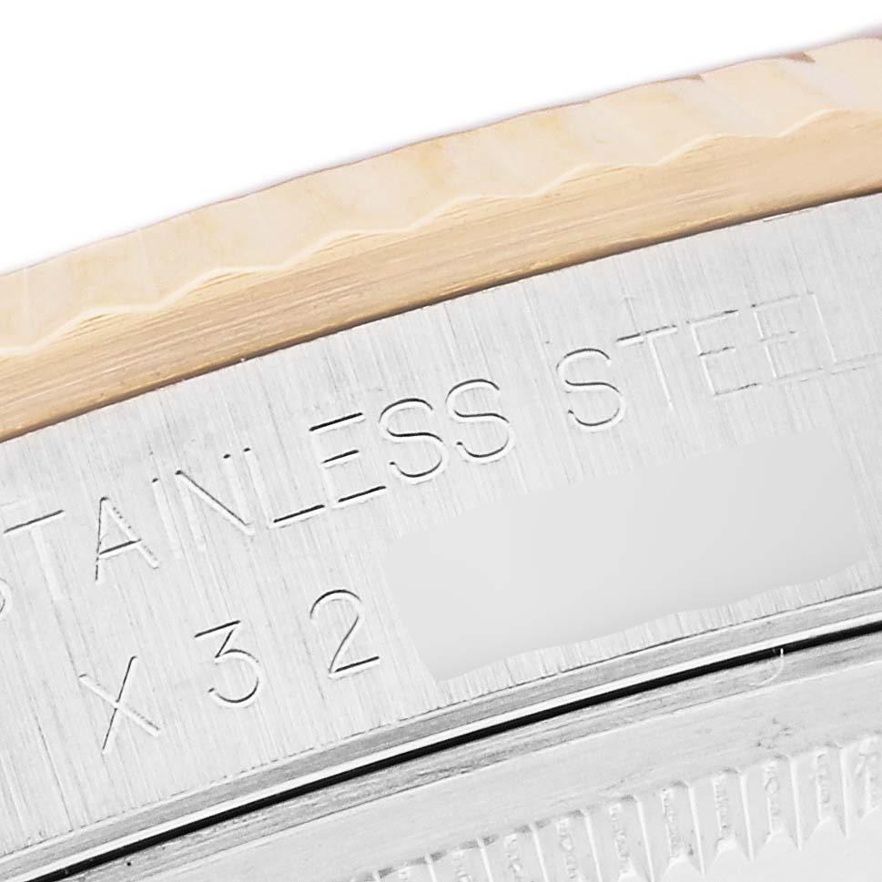 The image shows a close-up of the stainless steel back of a Rolex Datejust 16233 Men's Steel and Gold (two tone) White Dial 16233 Men's Steel and Gold (two tone) White Dial watch, highlighting the engraved text.