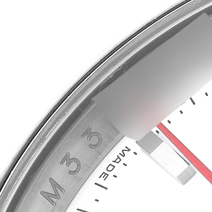 This close-up image of the Rolex Turn-o-Graph 116264 Men's Stainless Steel White Dial 116264 Men's Stainless Steel White Dial watch shows part of the bezel, dial, and hour markers.