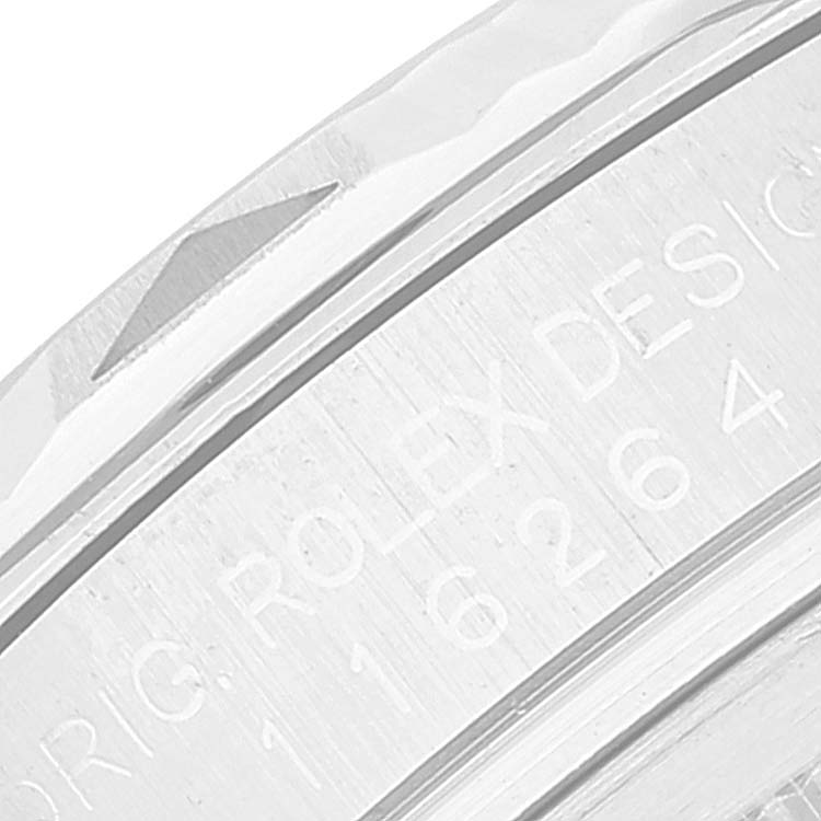 This close-up image shows the engraved bezel of a Rolex Turn-o-Graph 116264 Men's Stainless Steel White Dial 116264 Men's Stainless Steel White Dial watch.