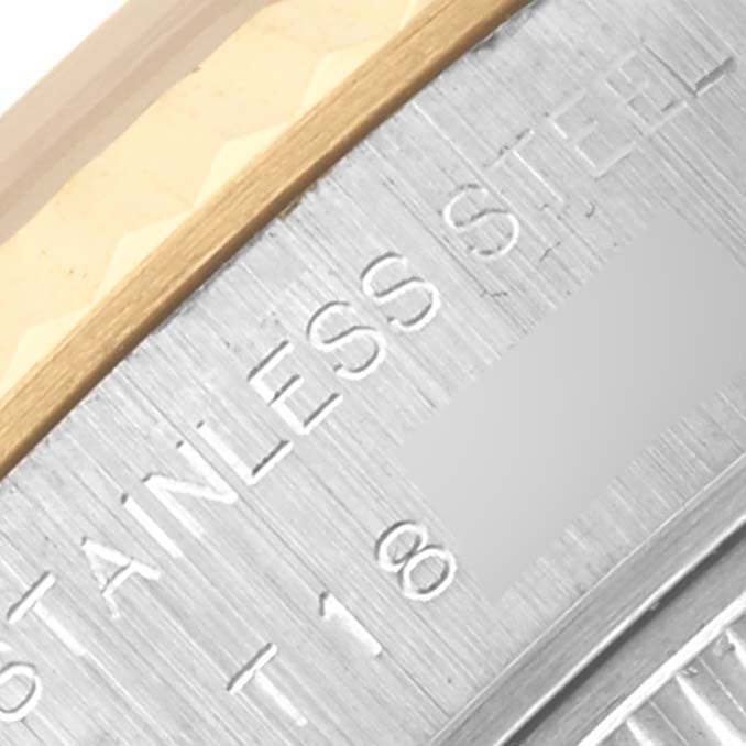 The image shows a close-up of the bezel and engraved "STAINLESS STEEL" on the Rolex Datejust 69173 Women's Steel and Gold (two tone) White Dial 69173 Women's Steel and Gold (two tone) White Dial watch.