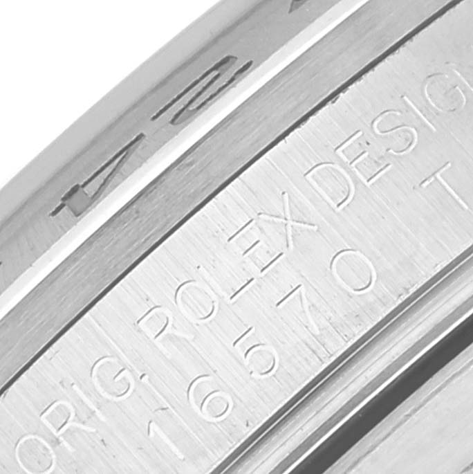 This image shows a close-up of the engraved inner bezel of the Rolex Explorer 16570 Men
s Stainless Steel White Dial 16570 Men
s Stainless Steel White Dial watch.