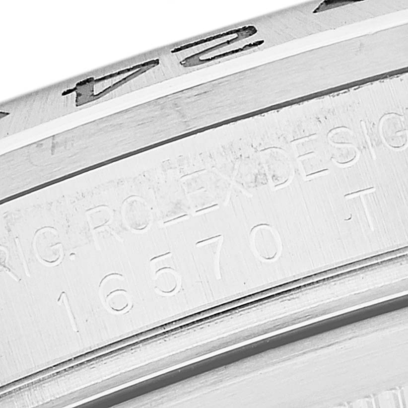 This image shows a close-up of the edge and engraved serial number on the bezel of a Rolex Explorer 16570 Men
s Stainless Steel White Dial 16570 Men
s Stainless Steel White Dial watch.