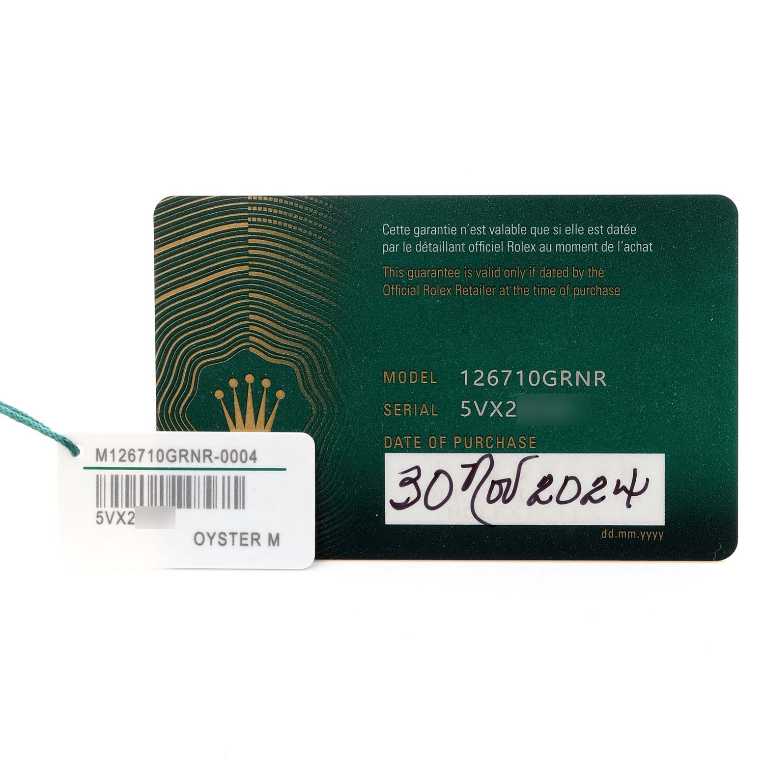 The image shows warranty and serial cards for the Rolex GMT-Master 126710GRNR Men
s Stainless Steel Black Dial 126710GRNR Men
s Stainless Steel Black Dial model 126710GRNR.