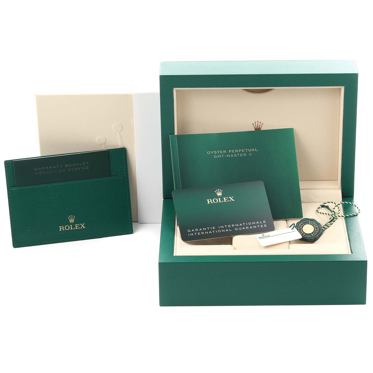 The image shows a Rolex GMT-Master 126710GRNR Men
s Stainless Steel Black Dial 126710GRNR Men
s Stainless Steel Black Dial watch box, booklets, warranty card, and tags, viewed from above.