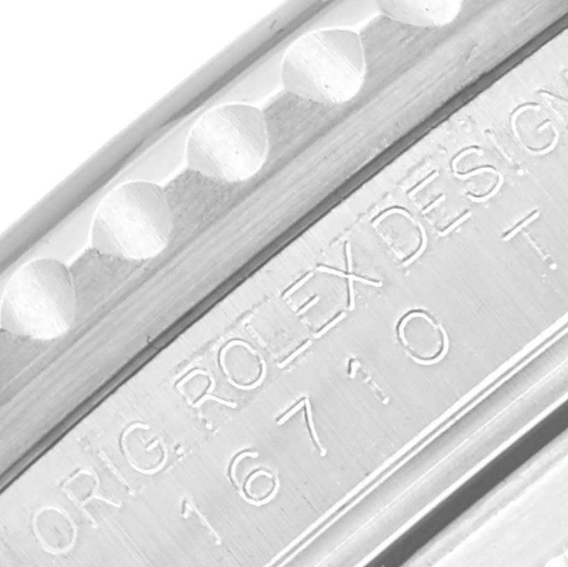 This close-up image shows the engraved case side of a Rolex GMT-Master 16710 Men
s Stainless Steel Black Dial 16710 Men
s Stainless Steel Black Dial, highlighting the model number "16710" and "ORIG. ROLEX DESIGN" text.