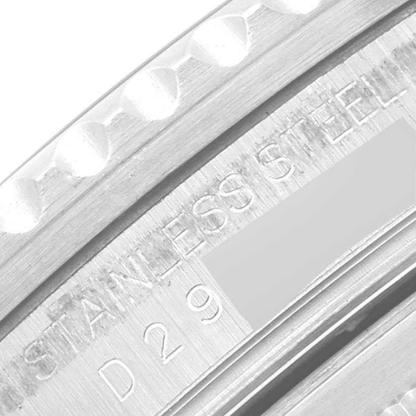 This close-up image of the Rolex GMT-Master 16710 Men
s Stainless Steel Black Dial 16710 Men
s Stainless Steel Black Dial watch shows the stainless steel bezel and partial engravings inside the case.