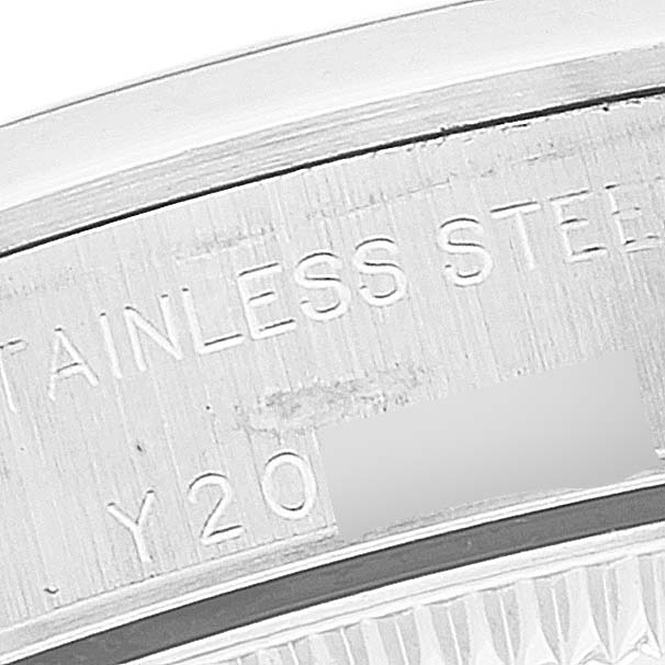This image shows a close-up of the engraved inner casing of a Rolex Oyster Perpetual 76080 Women's Stainless Steel Black Dial 76080 Women's Stainless Steel Black Dial watch.