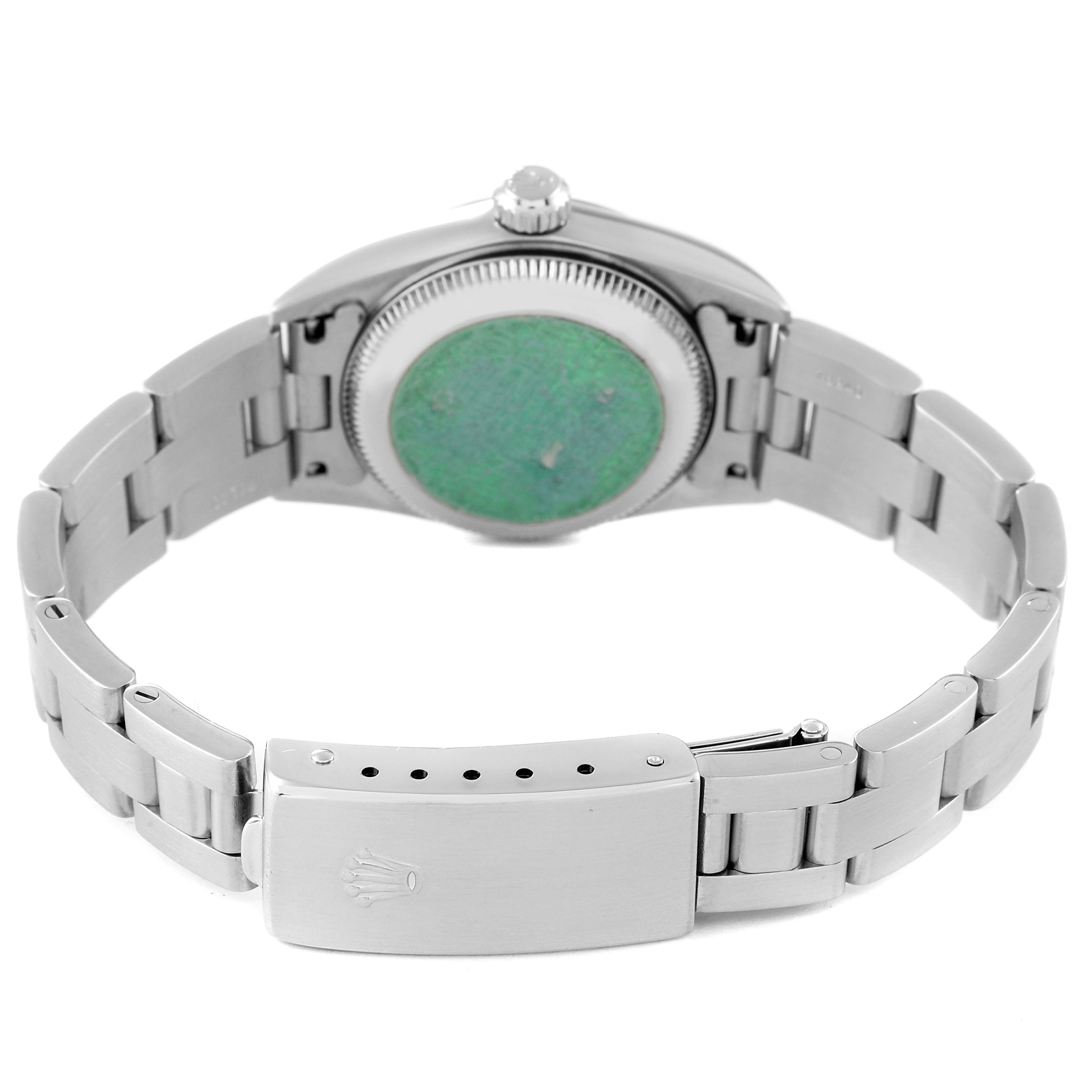 This image shows the backside of a Rolex Oyster Perpetual 76080 Women's Stainless Steel Black Dial 76080 Women's Stainless Steel Black Dial watch, highlighting the case back and the clasp of the bracelet.