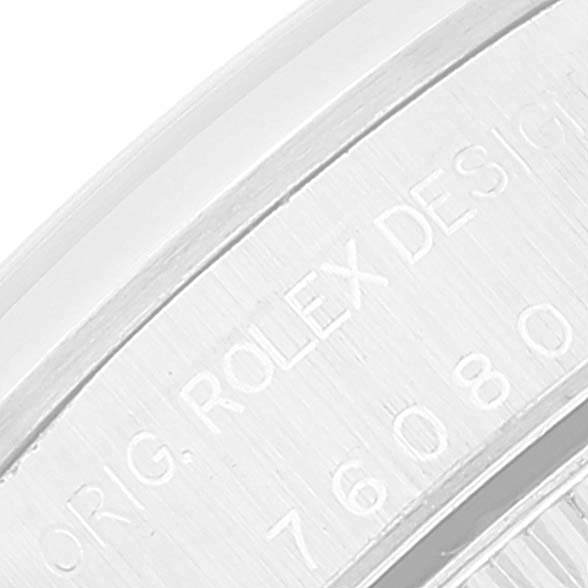 This image shows a close-up of the engraved text on the case of an Oyster Perpetual Rolex watch.