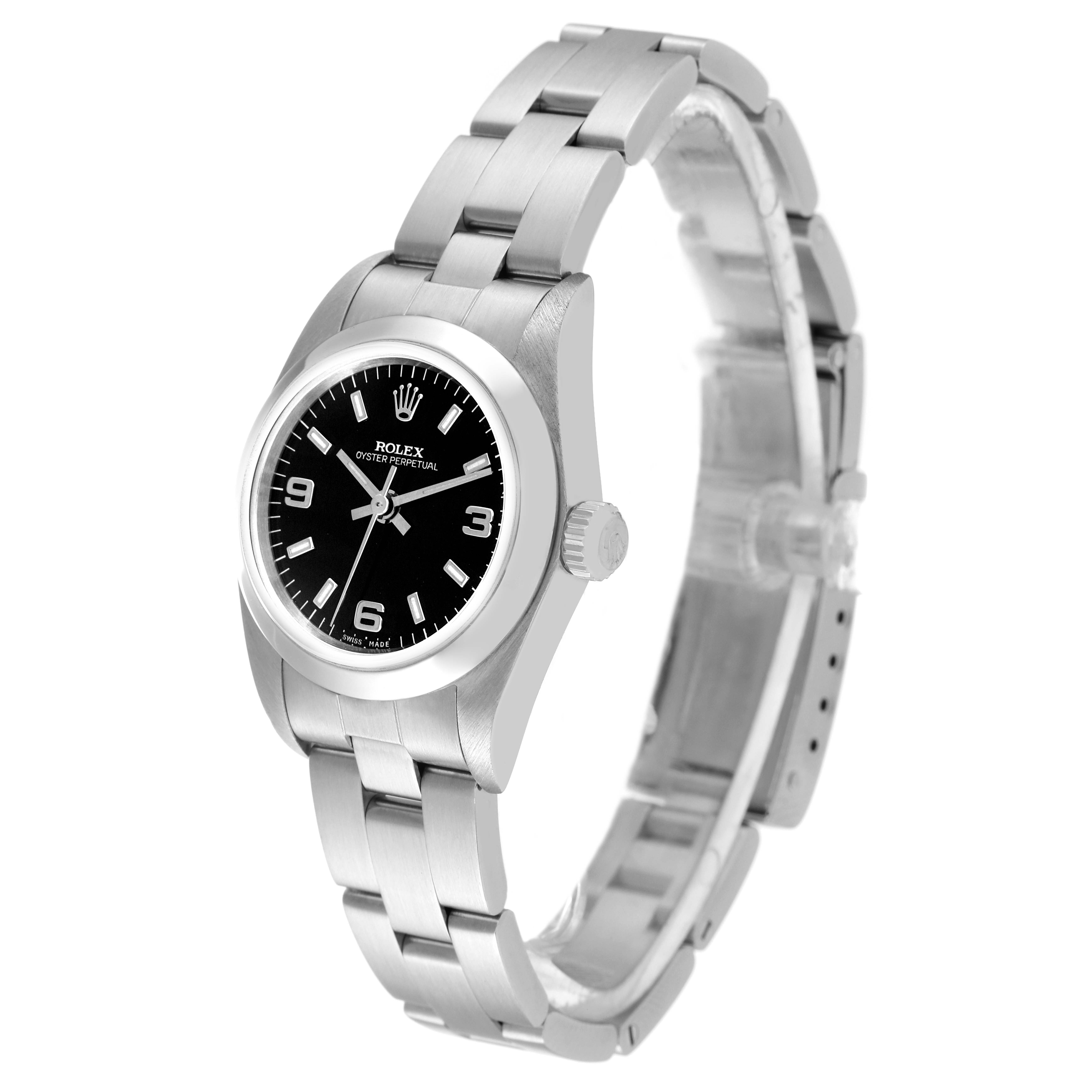 The image shows a side angle view of a Rolex Oyster Perpetual 76080 Women's Stainless Steel Black Dial 76080 Women's Stainless Steel Black Dial watch, highlighting its black dial, bezel, crown, and steel bracelet.