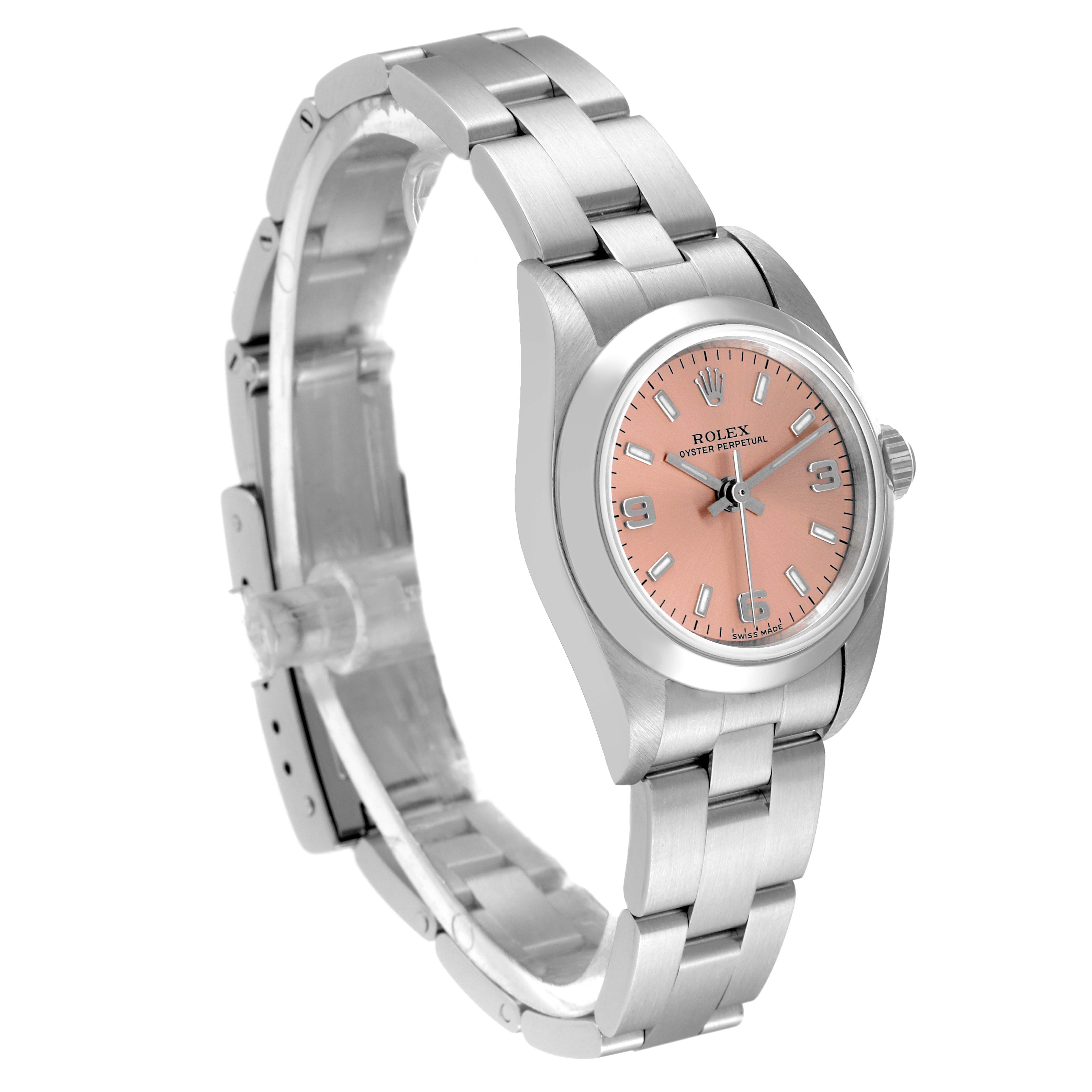 The Rolex Oyster Perpetual 76080 Women
s Stainless Steel Pink Dial 76080 Women
s Stainless Steel Pink Dial watch is shown at an angled side view, highlighting the bracelet, pink dial, and partially visible crown.