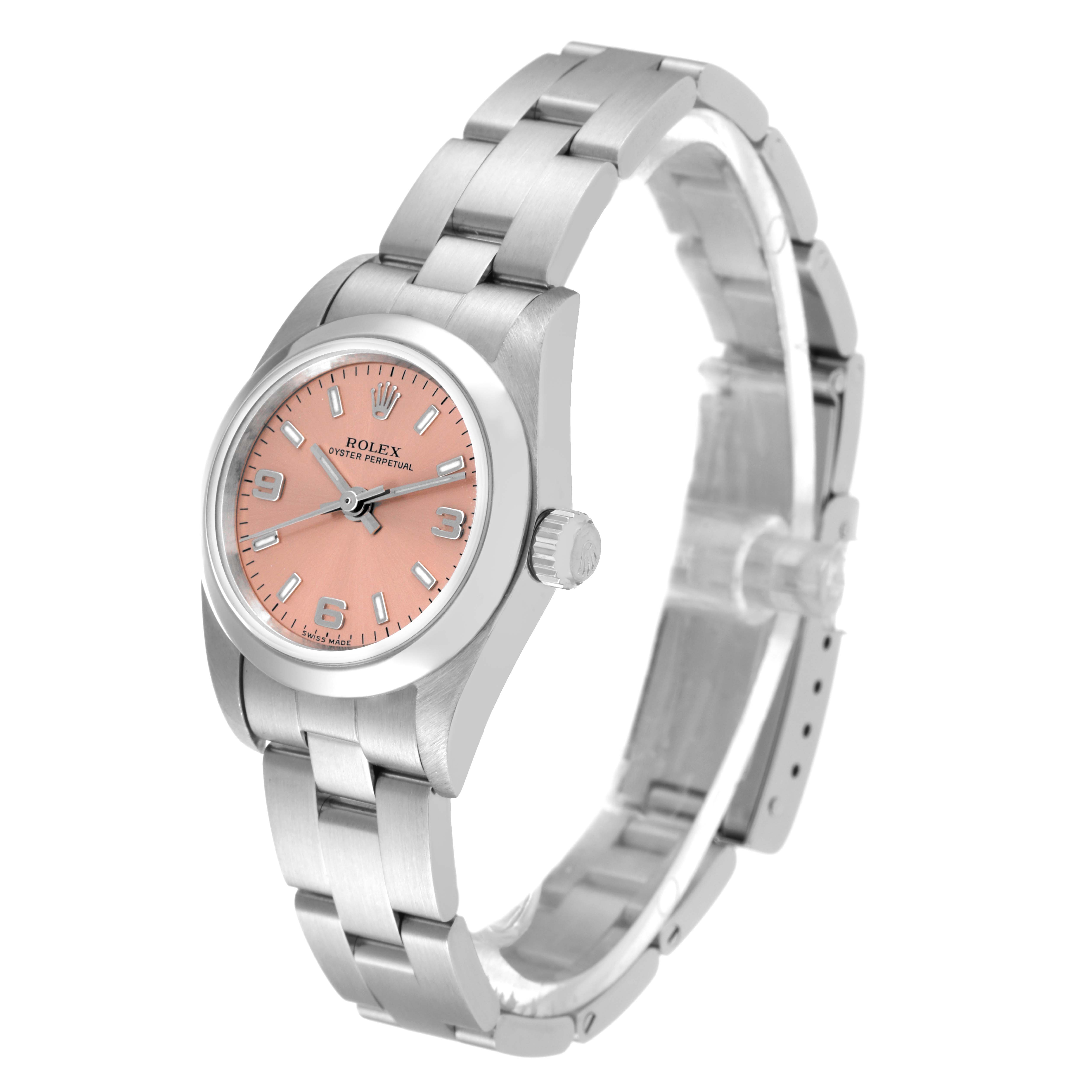 The Rolex Oyster Perpetual 76080 Women
s Stainless Steel Pink Dial 76080 Women
s Stainless Steel Pink Dial watch is shown from a 3/4 angle, highlighting the pink dial and stainless steel bracelet.