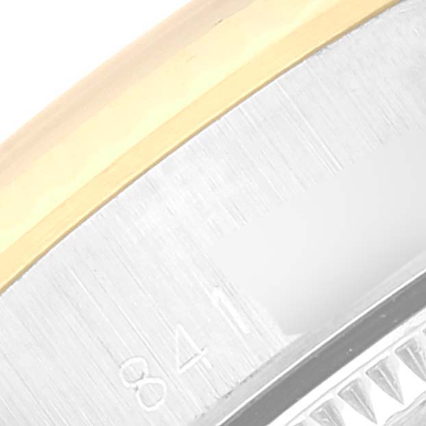 This image shows a close-up of the bezel and edge of the case of a Rolex Oyster Perpetual 67193 Women
s Steel and Gold (two tone) Champagne Dial 67193 Women
s Steel and Gold (two tone) Champagne Dial watch.