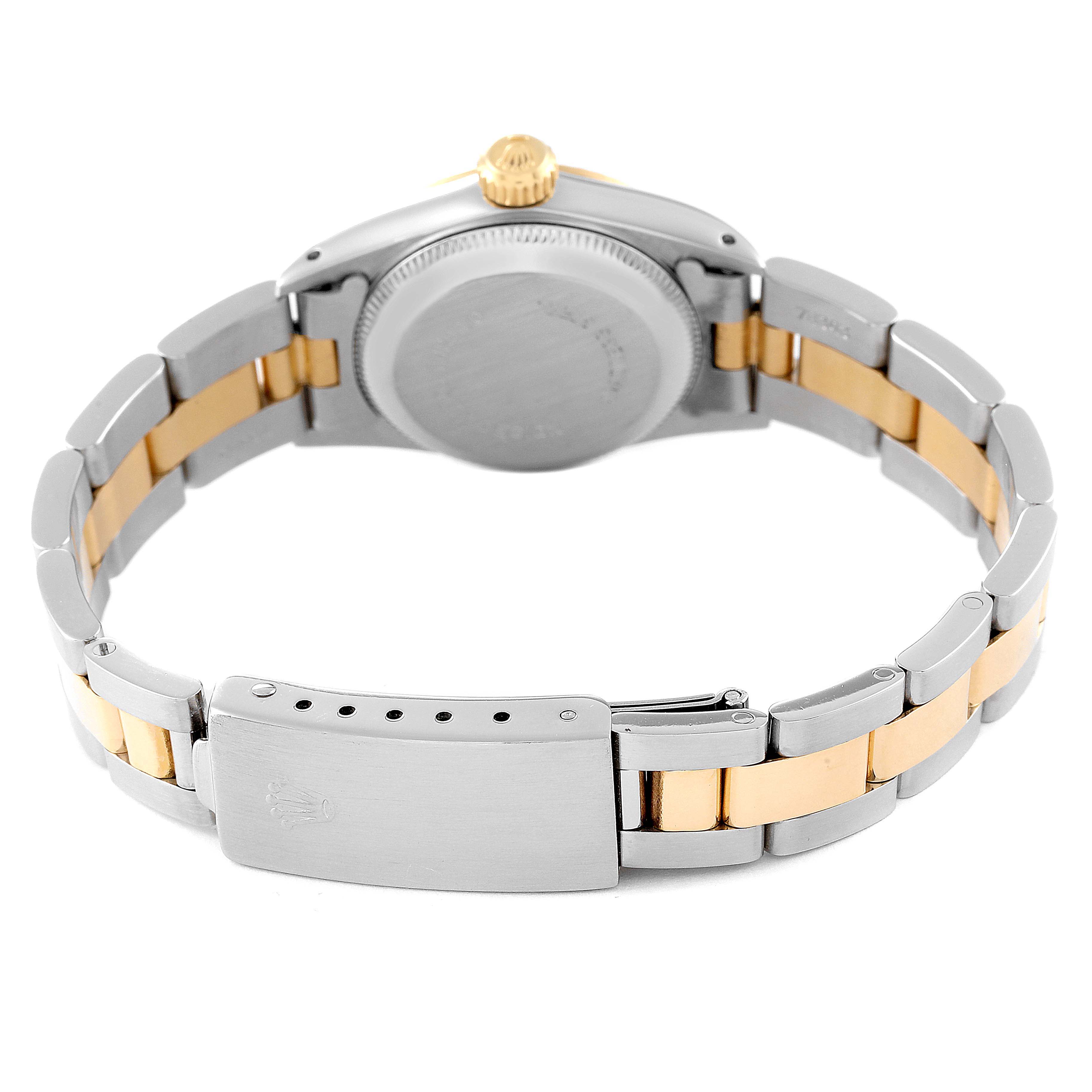 The image shows the back view of a Rolex Oyster Perpetual 67193 Women
s Steel and Gold (two tone) Champagne Dial 67193 Women
s Steel and Gold (two tone) Champagne Dial watch, highlighting the case back, crown, and the bracelet with a clasp.