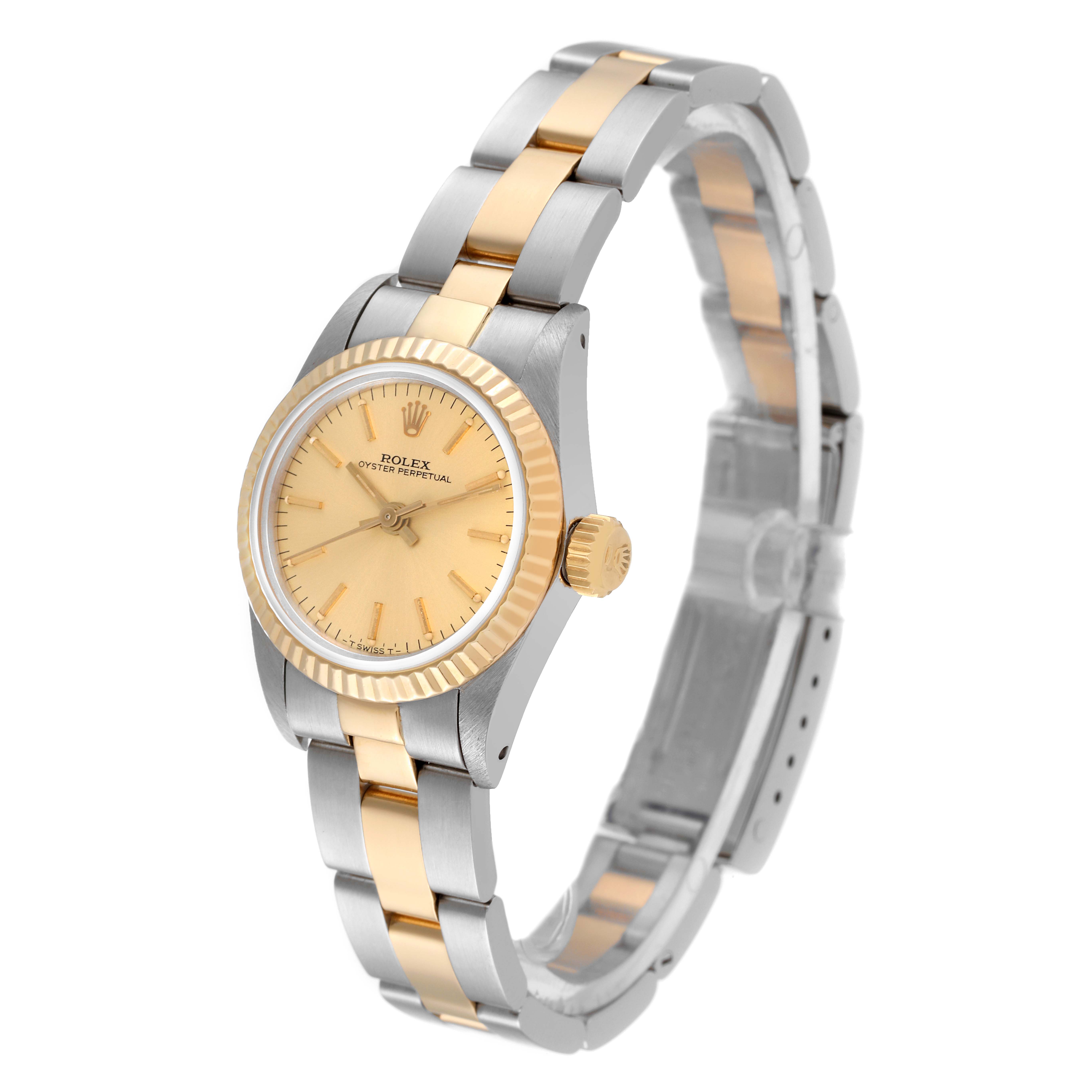 The image shows a frontal angled view of a Rolex Oyster Perpetual 67193 Women
s Steel and Gold (two tone) Champagne Dial 67193 Women
s Steel and Gold (two tone) Champagne Dial watch, highlighting its dial, bezel, and two-tone bracelet.