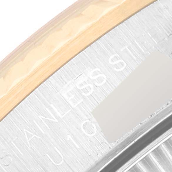 This close-up image shows the case back of a Rolex Oyster Perpetual 67193 Women's Steel and Gold (two tone) Champagne Dial 67193 Women's Steel and Gold (two tone) Champagne Dial watch, with the "Stainless Steel" marking visible.