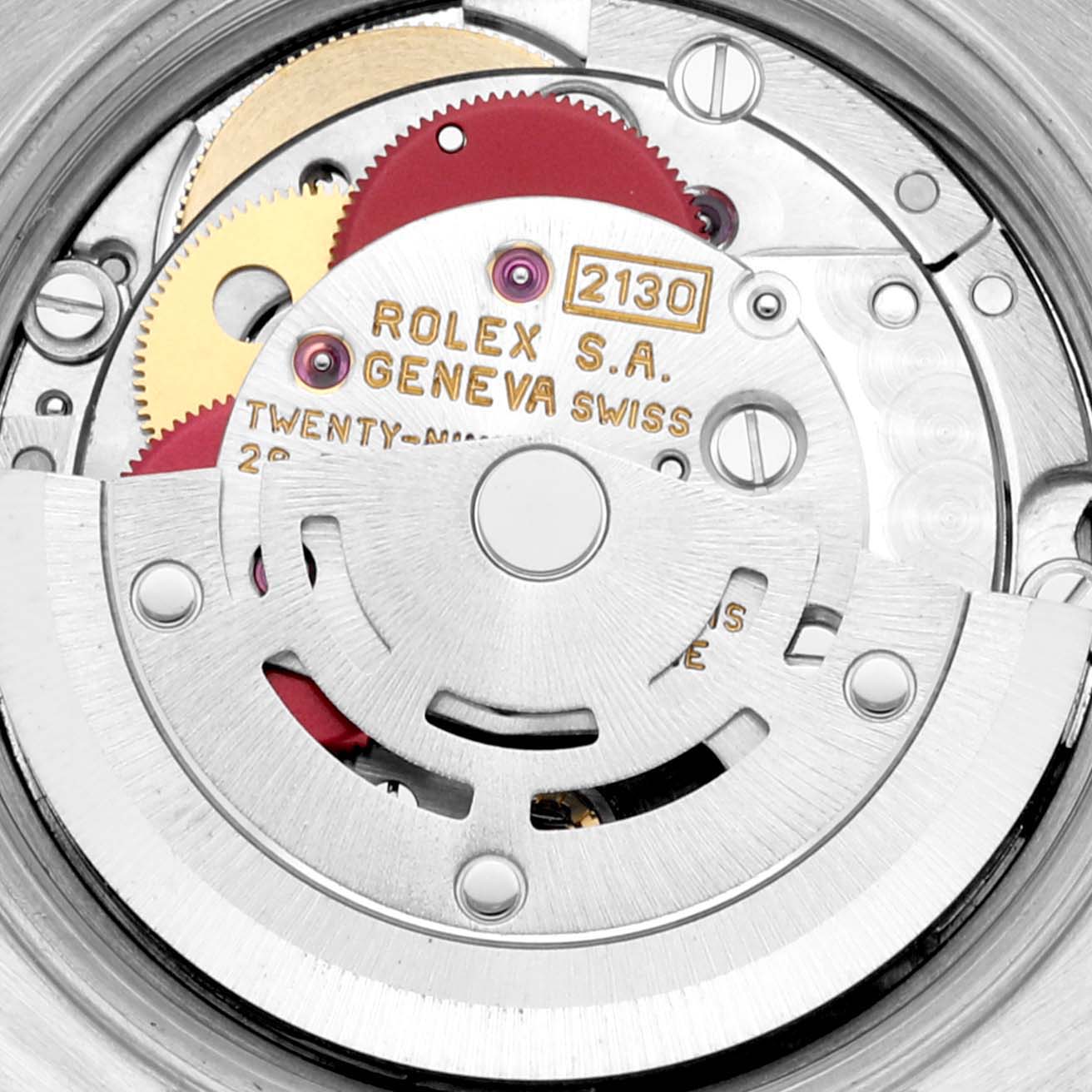 This image shows the inner mechanical movement of a Rolex Oyster Perpetual 67193 Women's Steel and Gold (two tone) Champagne Dial 67193 Women's Steel and Gold (two tone) Champagne Dial watch, highlighting its intricate gears and components.