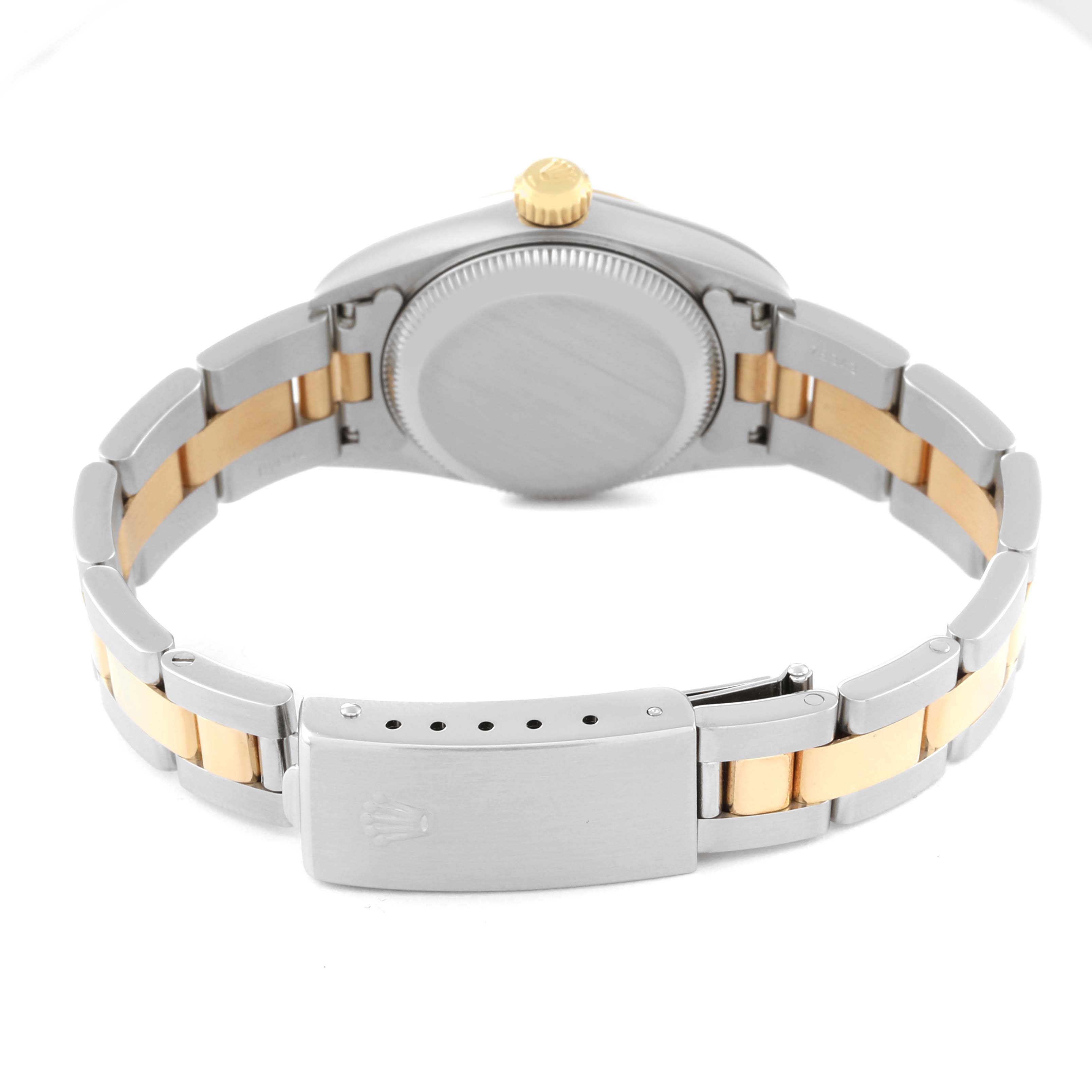 The Rolex Oyster Perpetual 67193 Women's Steel and Gold (two tone) Champagne Dial 67193 Women's Steel and Gold (two tone) Champagne Dial watch is shown from the rear angle, displaying the case back, crown, and two-tone bracelet with the clasp.