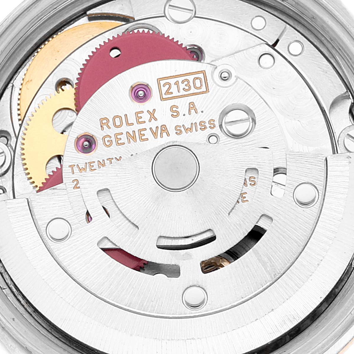 This image shows a close-up of the movement mechanism of a Rolex Oyster Perpetual 67183 Women
s Steel and Gold (two tone) Silver Dial 67183 Women
s Steel and Gold (two tone) Silver Dial watch, featuring gears and inscriptions.