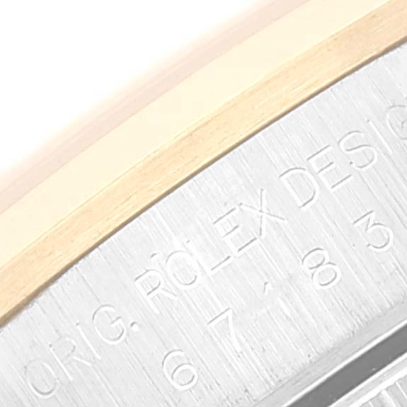 This image shows a close-up of the side engraving on the Rolex Oyster Perpetual 67183 Women
s Steel and Gold (two tone) Silver Dial 67183 Women
s Steel and Gold (two tone) Silver Dial watch case.