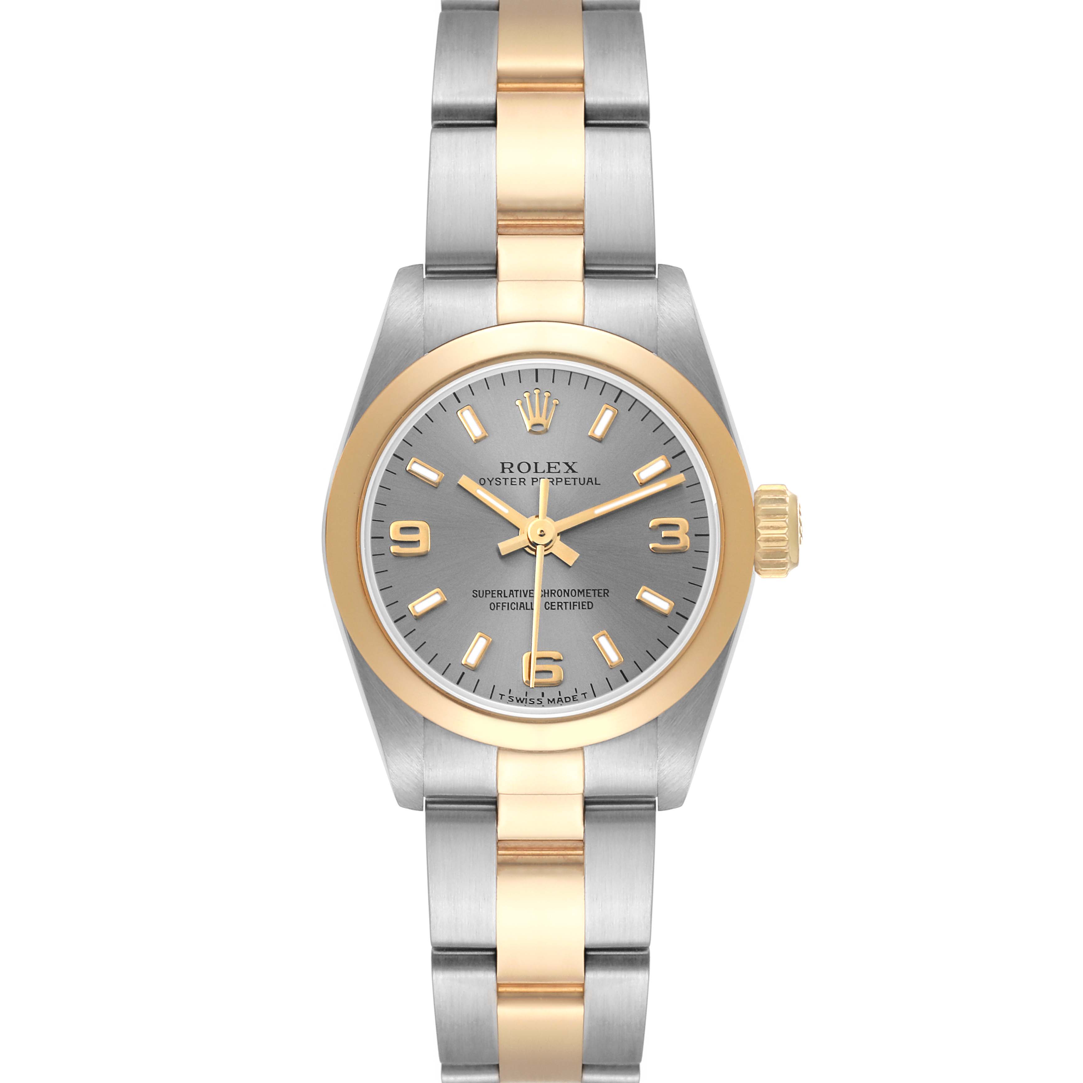 This image shows the Rolex Oyster Perpetual 67183 Women
s Steel and Gold (two tone) Silver Dial 67183 Women
s Steel and Gold (two tone) Silver Dial watch from a top-down view, highlighting the dial, bezel, and bracelet.