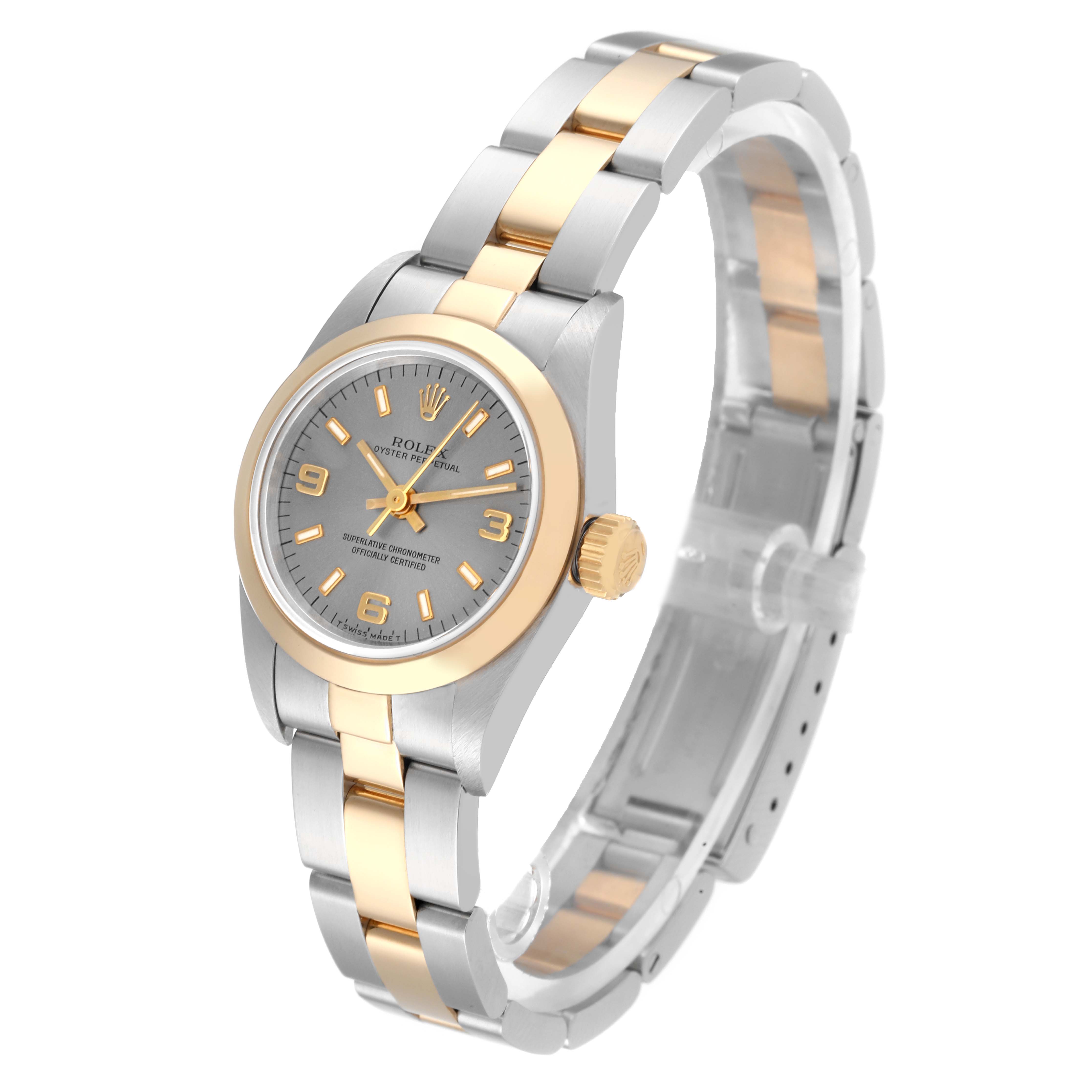 The Rolex Oyster Perpetual 67183 Women's Steel and Gold (two tone) Grey Dial 67183 Women's Steel and Gold (two tone) Grey Dial watch is shown from an angled top view displaying the dial, bezel, crown, and bracelet.