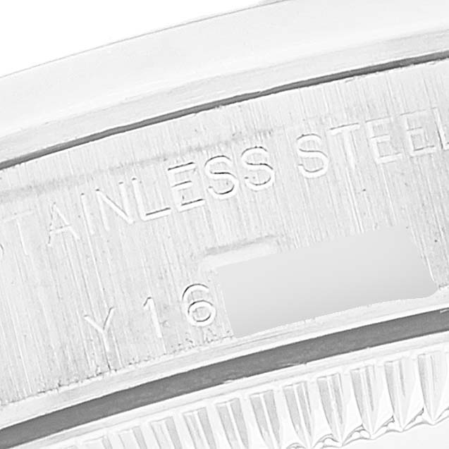 The image shows a close-up of the stainless steel case back of the Rolex Oyster Perpetual 76080 Women's Stainless Steel White Dial 76080 Women's Stainless Steel White Dial watch featuring some of its engraved details.