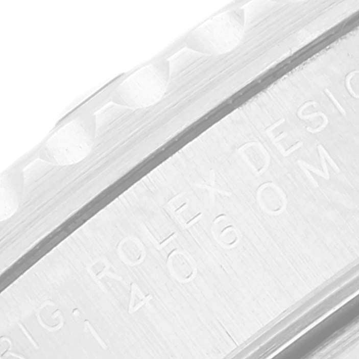 This close-up image shows the engraving on the side of the bezel of a Rolex Submariner 14060M Men
s Stainless Steel Black Dial 14060M Men
s Stainless Steel Black Dial watch.